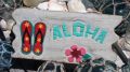 Aloha Schild mit Flip-Flops